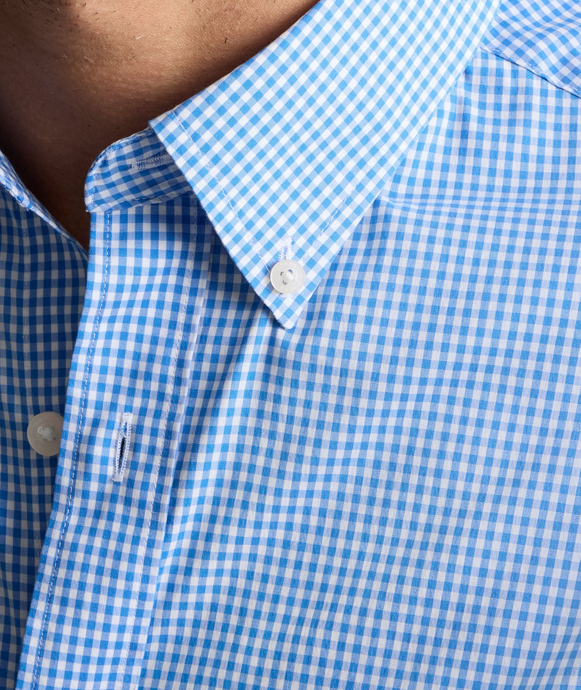 Model is wearing UNTUCKit CottonTek Harland Shirt in blue. 