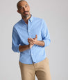 Model is wearing UNTUCKit CottonTek Harland Shirt in blue. 