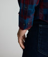 Model is wearing UNTUCKit Heinrich flannel in plaid blue. 