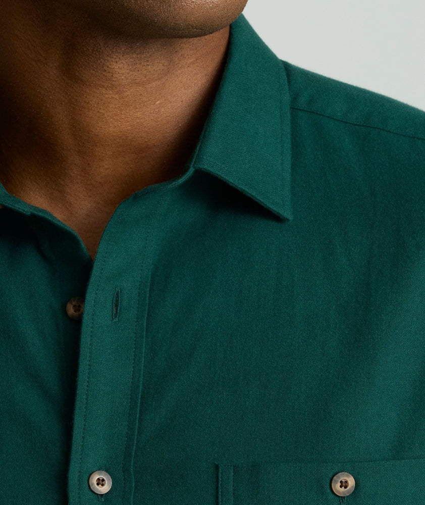 Model is wearing UNTUCKit Flannel Hemsworth Shirt in scarab. 