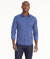 Model is wearing UNTUCKit Wrinkle-Free Performance Langhorne Shirt in Blue Grounded Check.