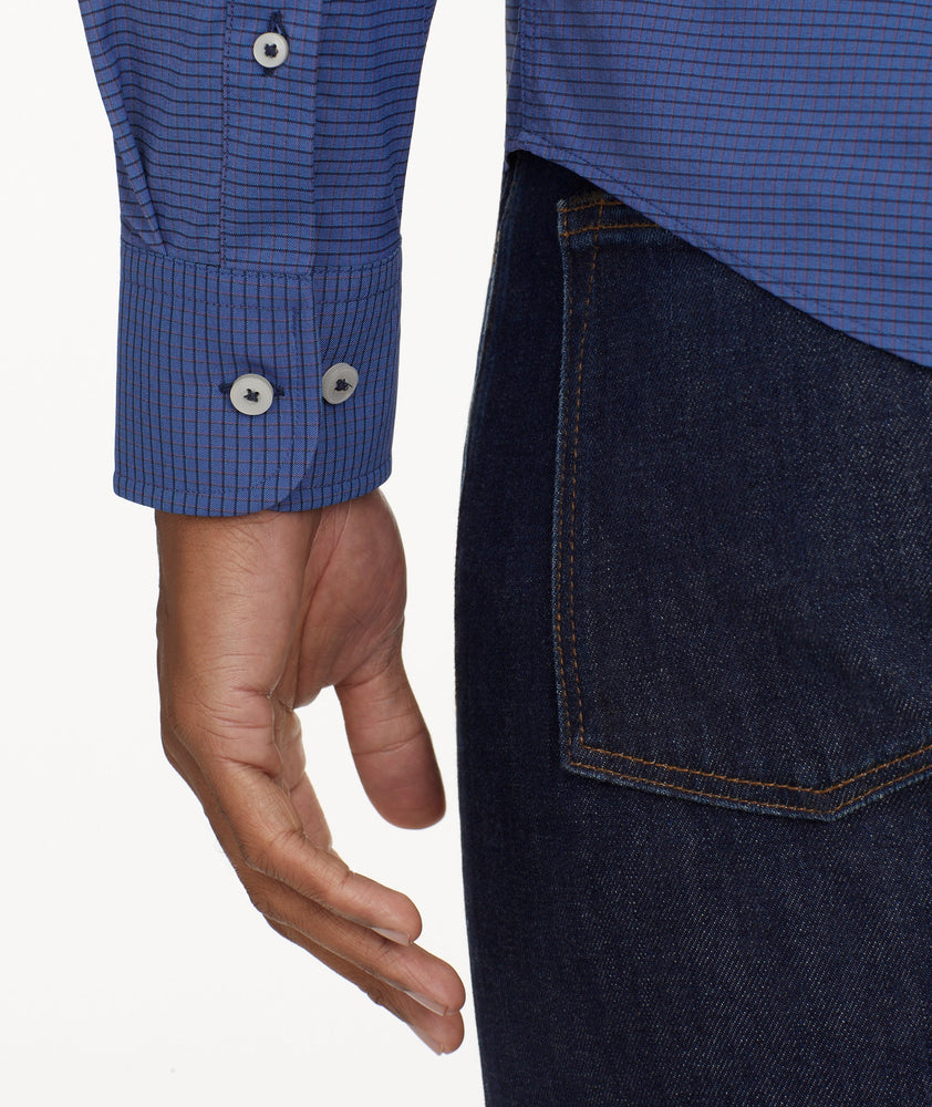 Model is wearing UNTUCKit Wrinkle-Free Performance Langhorne Shirt in Blue Grounded Check.
