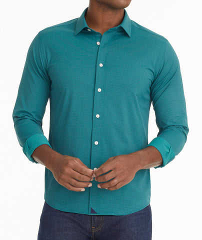 Model is wearing UNTUCKit Wrinkle-Free Performance Langhorne Shirt in Green Grounded Check.