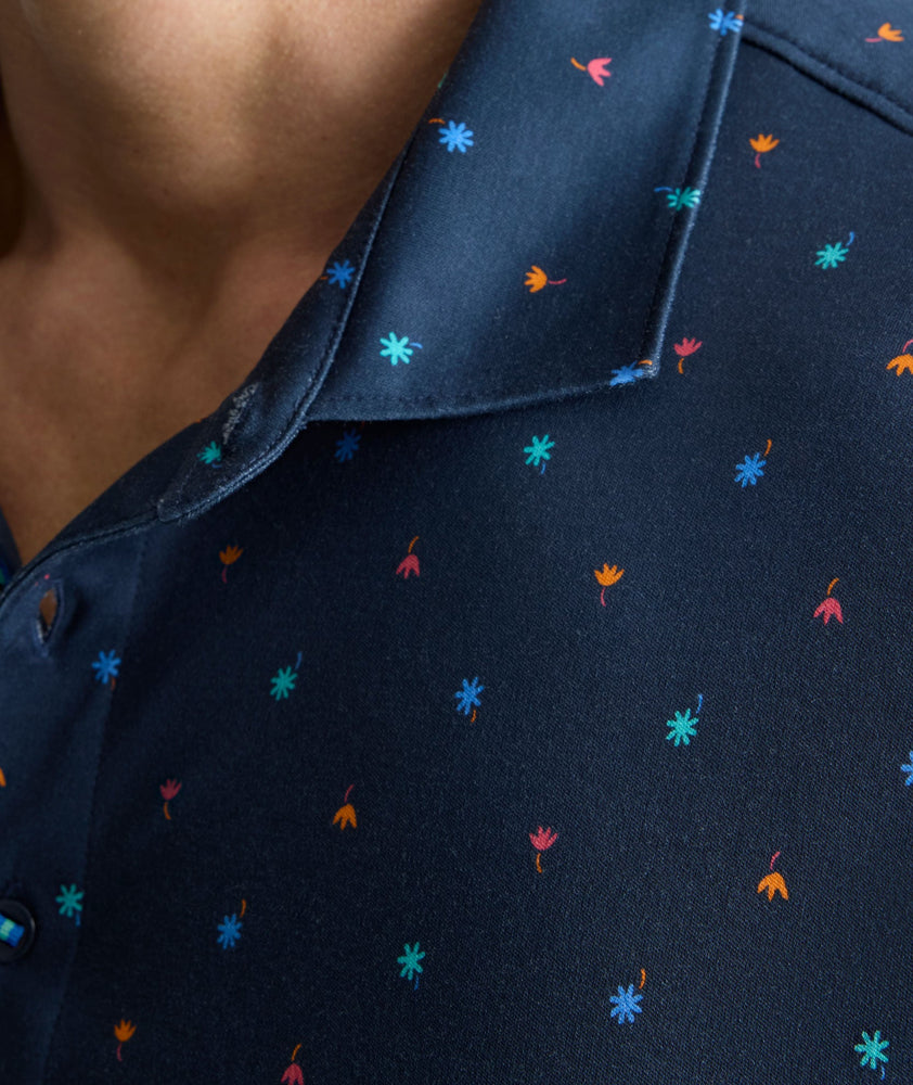 Model is wearing UNTUCKit Wrinkle-Free Damaschino Polo in navy floral. 