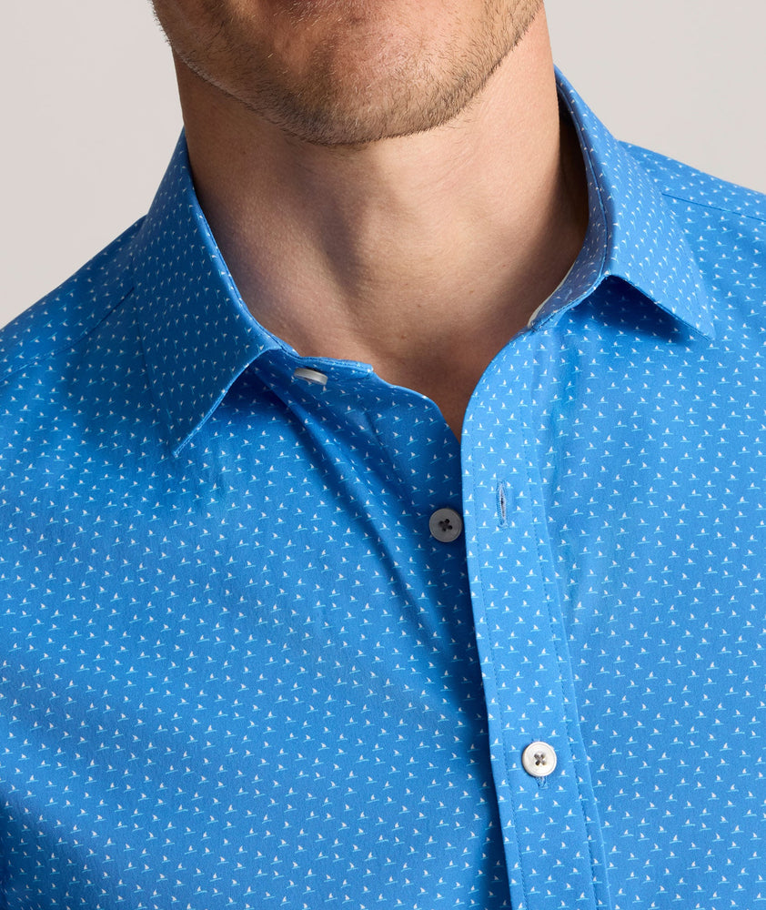 Model is wearing UNTUCKit Performance Short-Sleeve Livingston Shirt in Blue Shark Fin Print.