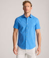 Model is wearing UNTUCKit Performance Short-Sleeve Livingston Shirt in Blue Shark Fin Print.