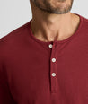 Model is wearing UNTUCKit EcoSoft Henley in Burgundy. 