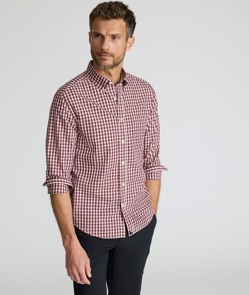 Model is wearing UNTUCKit Wrinkle-Free Marchand Shirt in Black, Red, & White Plaid.