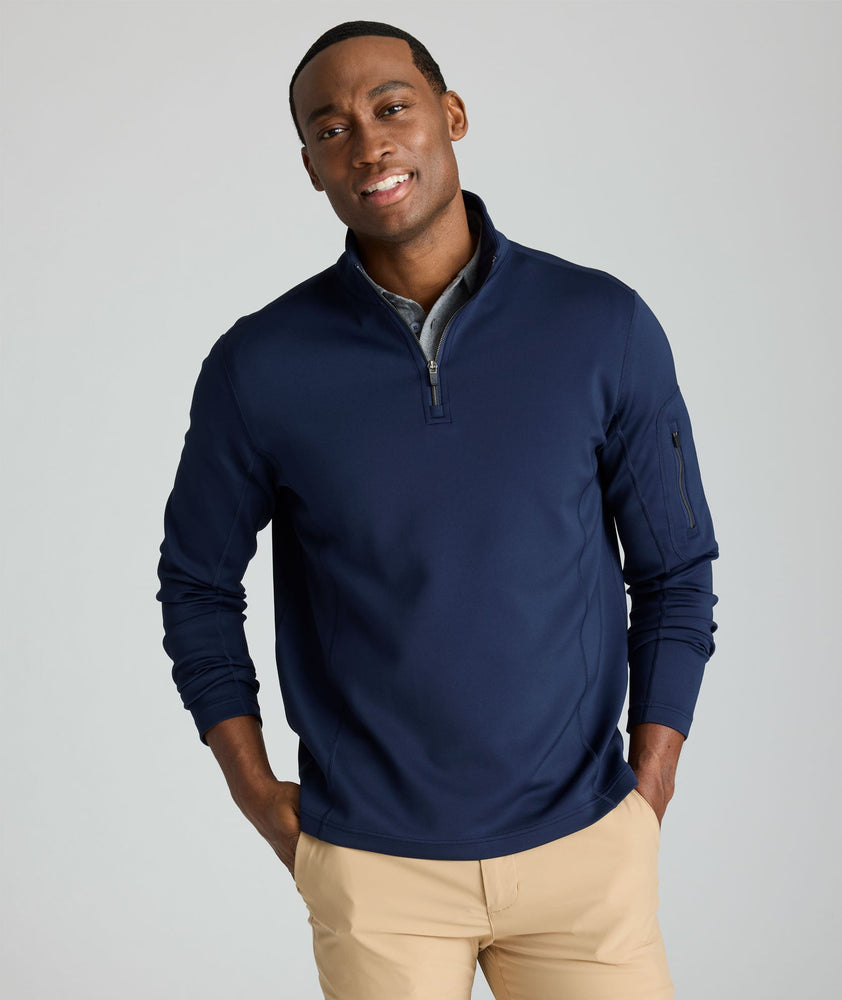 Model is wearing UNTUCKit performance sweatshirt in navy.