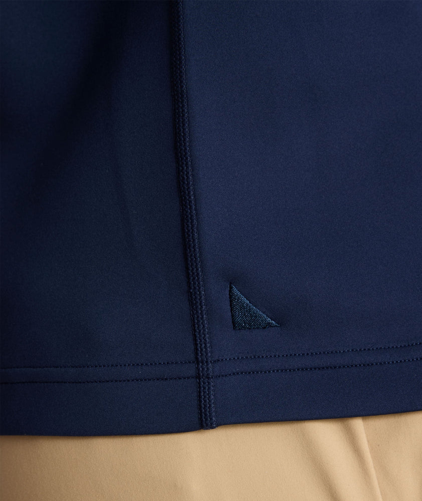 Model is wearing UNTUCKit performance sweatshirt in navy.