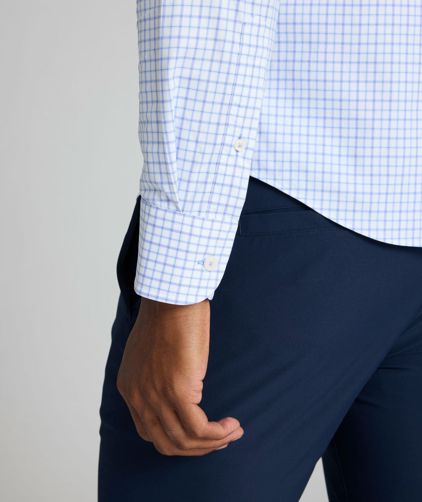 Model is wearing UNTUCKIt northcliffe performance check shirt in purple. 