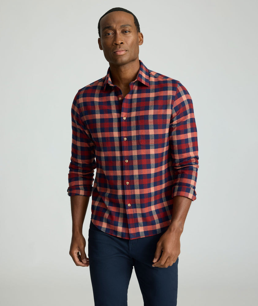 Model is wearing UNTUCKit Flannel Plenville Shirt in Syrah Check.