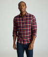 Model is wearing UNTUCKit Flannel Plenville Shirt in Syrah Check.