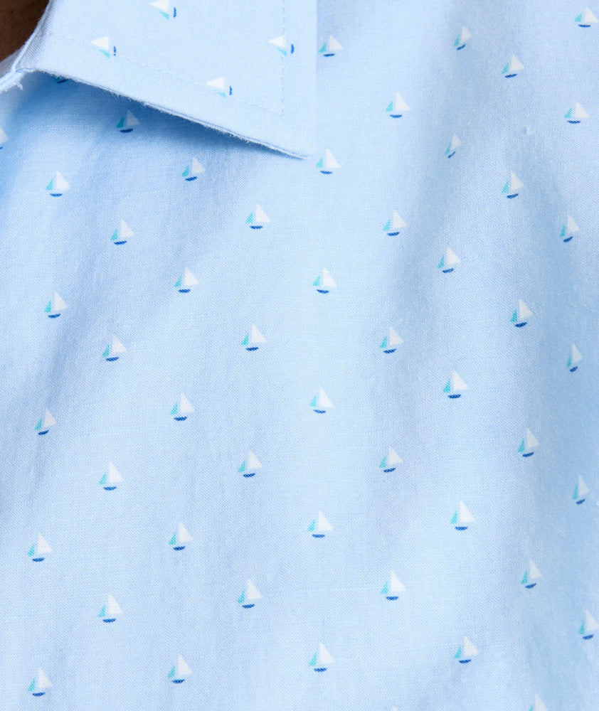 Model is wearing UNTUCKit Quinn cotton linen top in blue print. 