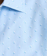 Model is wearing UNTUCKit Quinn cotton linen top in blue print. 