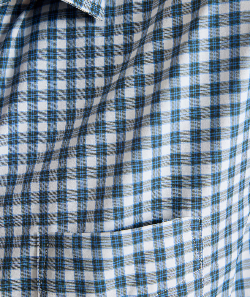 Model is wearing UNTUCKit Performance Renshaw Shirt in Green & White Plaid.