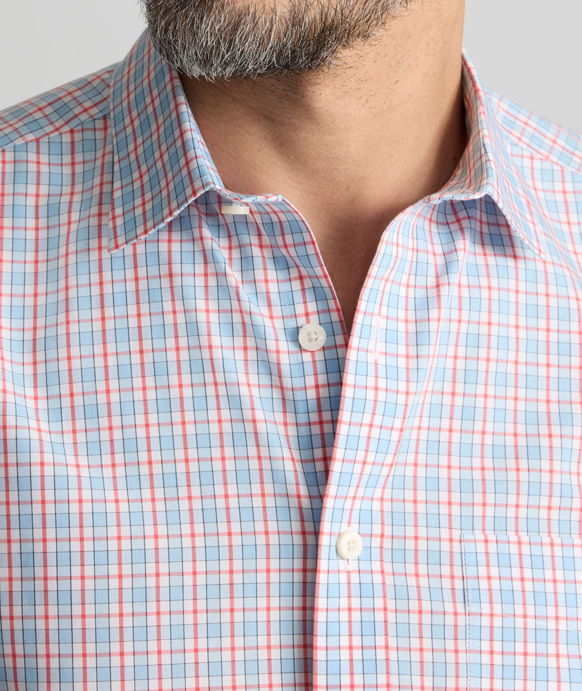 Model is wearing UNTUCKit Wrinkle-Free Ridgewell Shirt in blue-check.