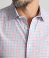 Model is wearing UNTUCKit Wrinkle-Free Ridgewell Shirt in blue-check.