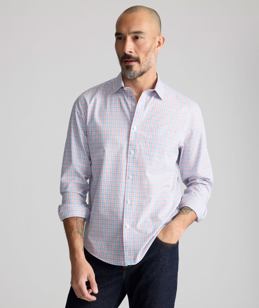 Model is wearing UNTUCKit Wrinkle-Free Ridgewell Shirt in blue-check.