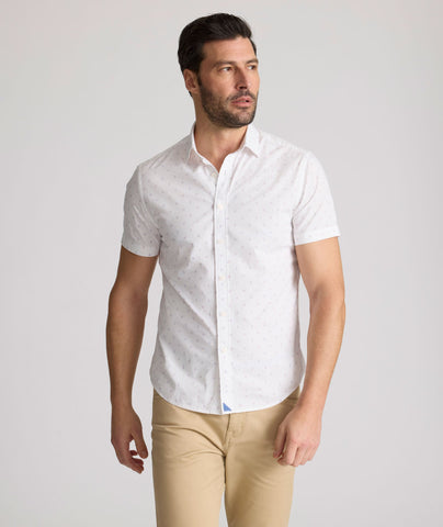 Model is wearing UNTUCKit Rockwell short sleeve cotton shirt. 