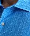 Model is wearing UNTUCKit CottonTek Polo in blue. 