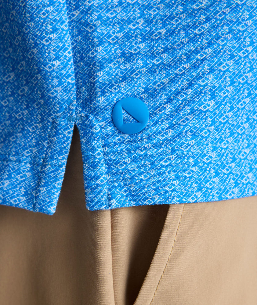 Model is wearing UNTUCKit CottonTek Polo in blue. 