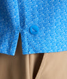 Model is wearing UNTUCKit CottonTek Polo in blue. 