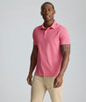 Model is wearing UNTUCKit Model is wearing UNTUCKit CottonTek Polo in Magenta Wine Bottle Print.