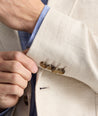 Model is wearing UNTUCKit Linen-Cotton Sagefield Sport Coat in Tan.