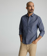 Model is wearing UNTUCKit Smithson wrinkle-free shirt in gray. 