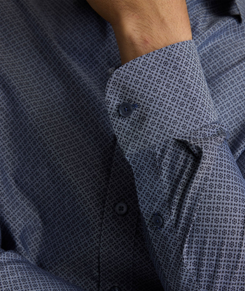 Model is wearing UNTUCKit Smithson wrinkle-free shirt in gray. 