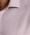 Model is wearing UNTUCKit Textured Performance Polo in fig. 
