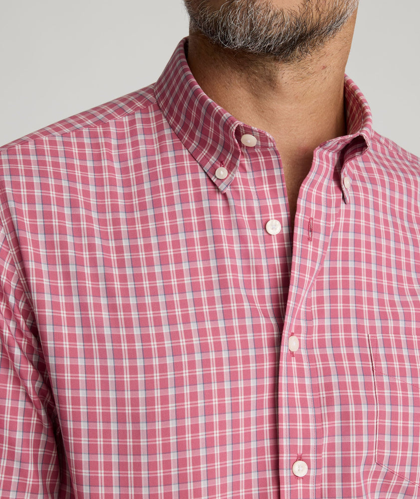 Model is wearing UNTUCKit Wrinkle-Free Thorne Shirt in red. 
