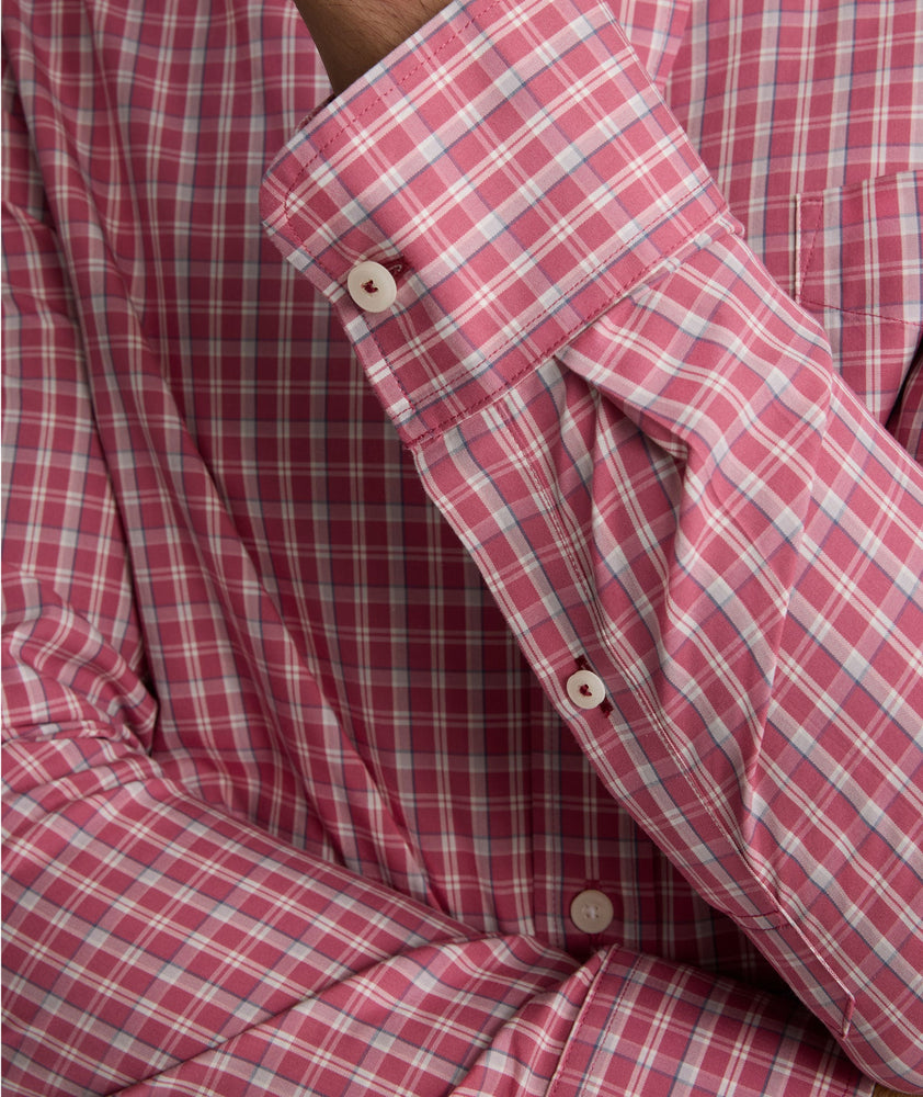 Model is wearing UNTUCKit Wrinkle-Free Thorne Shirt in red. 