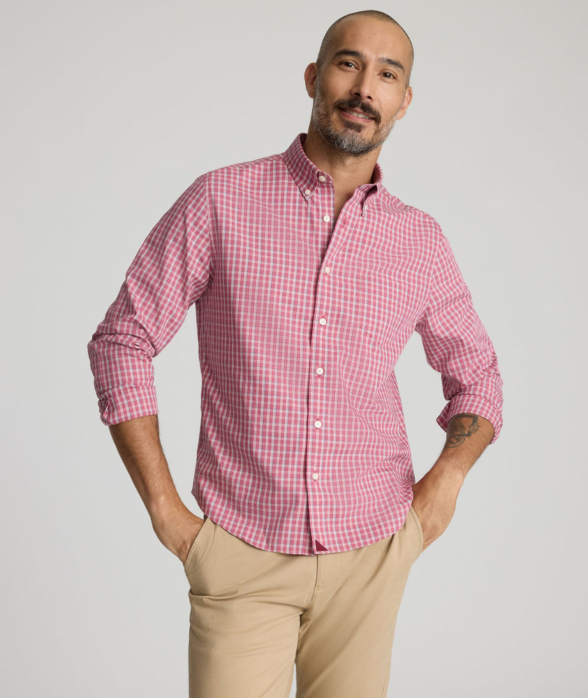 Model is wearing UNTUCKit Wrinkle-Free Thorne Shirt in red. 
