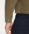 Model is wearing UNTUCKit Cotton-Linen Reid Jacket in Ivy Green.