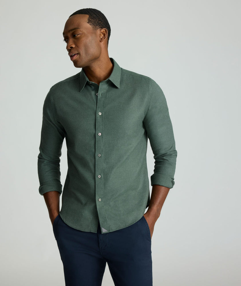 Model is wearing UNTUCKIt Wrinkle-Free Veneto Shirt in Deep Forest.