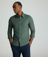 Model is wearing UNTUCKIt Wrinkle-Free Veneto Shirt in Deep Forest.