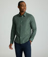 Model is wearing UNTUCKIt Wrinkle-Free Veneto Shirt in Deep Forest.