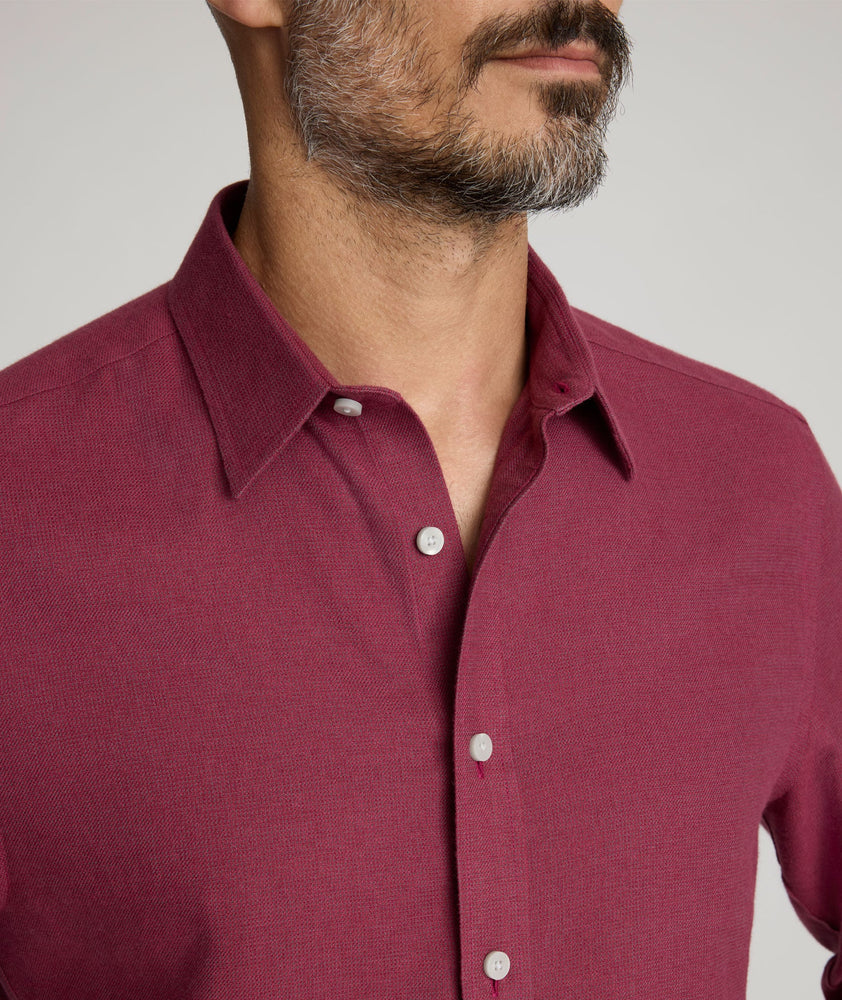 Model is wearing UNTUCKit Veneto wrinkle-free shirt in Rhododendron. 