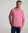 Model is wearing UNTUCKit Weatherby Performance Hoodie in Rose Wine.