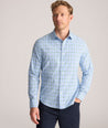 Model is wearing UNTUCKit Performance Whitman Shirt in Blue & Green Plaid