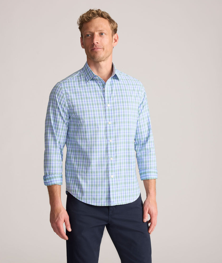 Model is wearing UNTUCKit Performance Whitman Shirt in Blue & Green Plaid