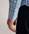 Model is wearing UNTUCKit Performance Whitman Shirt in Blue & Green Plaid
