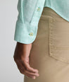 Model is wearing UNTUCKit Wrinkle-Resistant Linen Wildehart Shirt in green. 