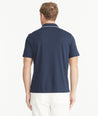 Model is wearing UNTUCKit Navy Tipped Johnny Collar Polo.