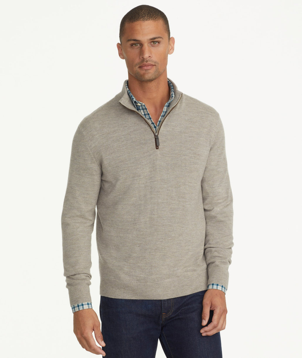 Model is wearing UNTUCKit Belguardo quarter zip in brown.