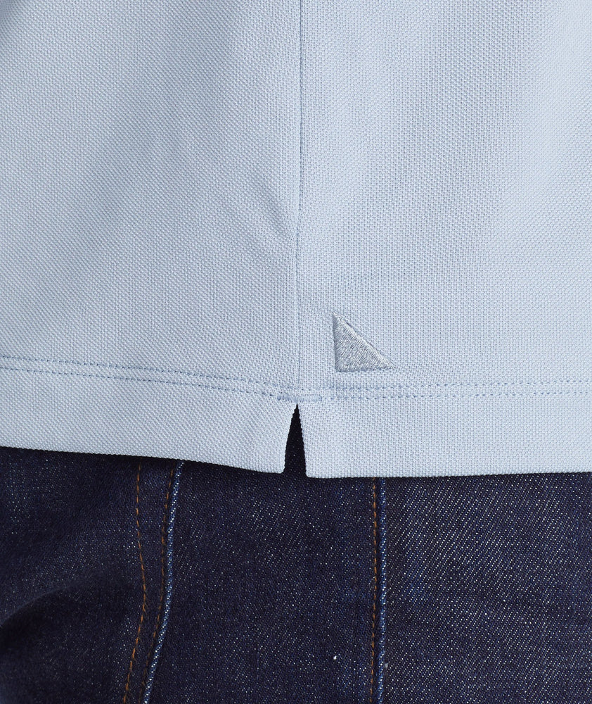 Model wearing a Blue Tipped Traveler Polo with COOLMAX®