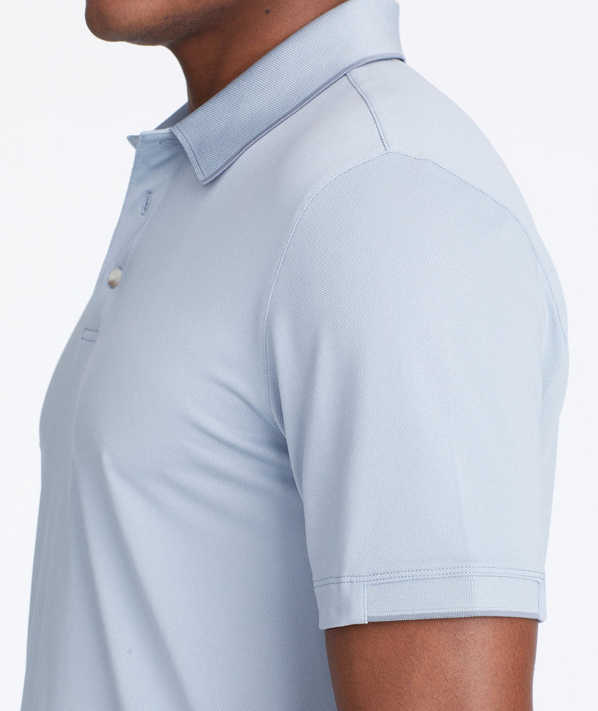 Model wearing a Blue Tipped Traveler Polo with COOLMAX®