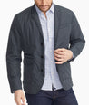 Model wearing a Grey The Travel Blazer